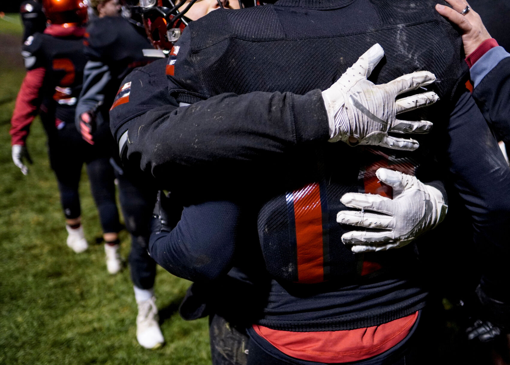 Two Southern Boone players hug after they made the first touchdown in the game